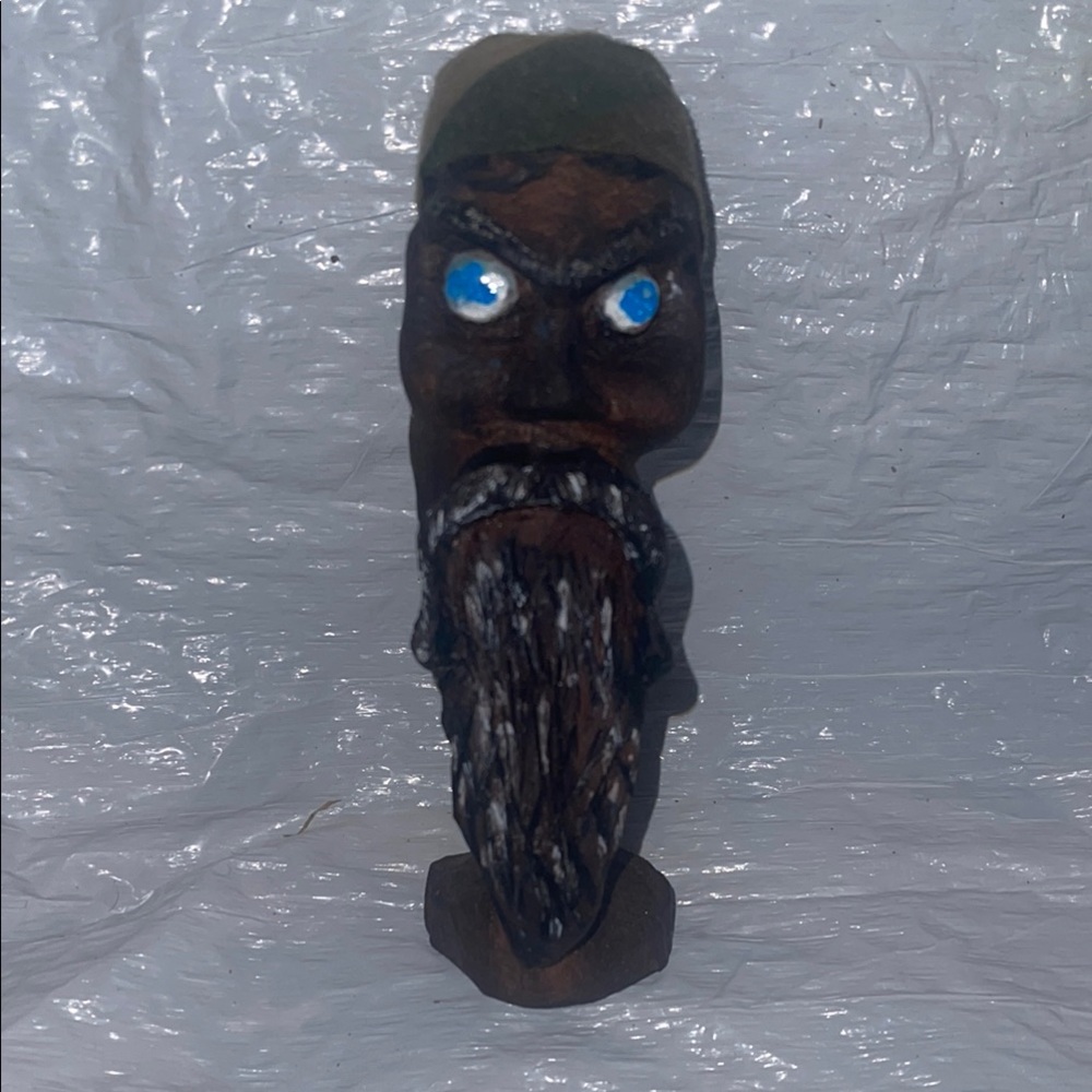 Handcrafted Wooden Figurine with Blue Eyes
